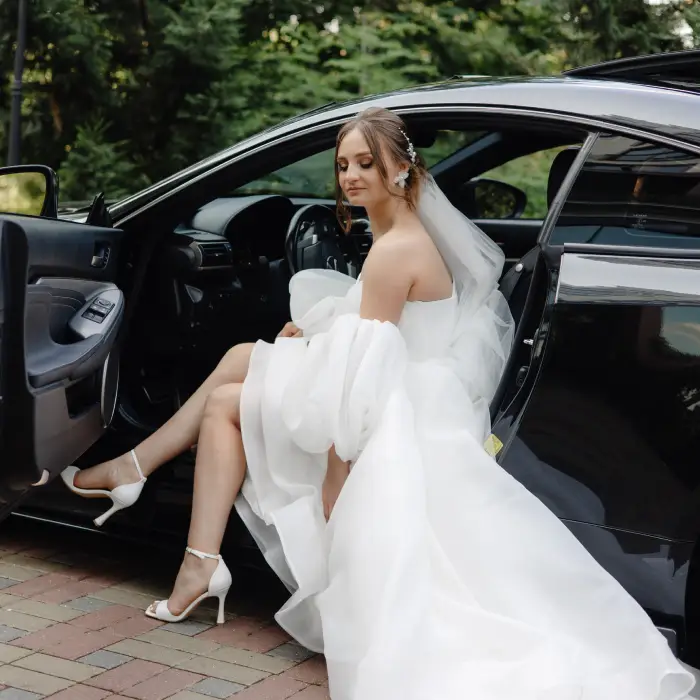 Elegant black wedding limousine parked near Boston wedding venue