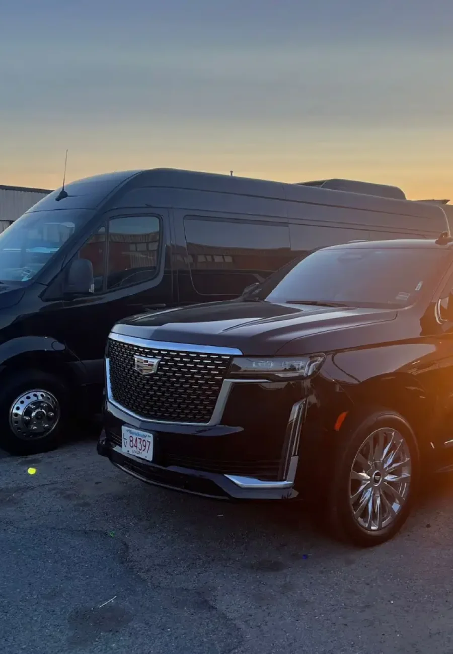 Smiling Alpha Limo Luxury chauffeur in car interior – Boston luxury transportation