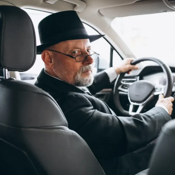 Alpha Limo Luxury chauffeur inside vehicle ready for premium car service in Boston
